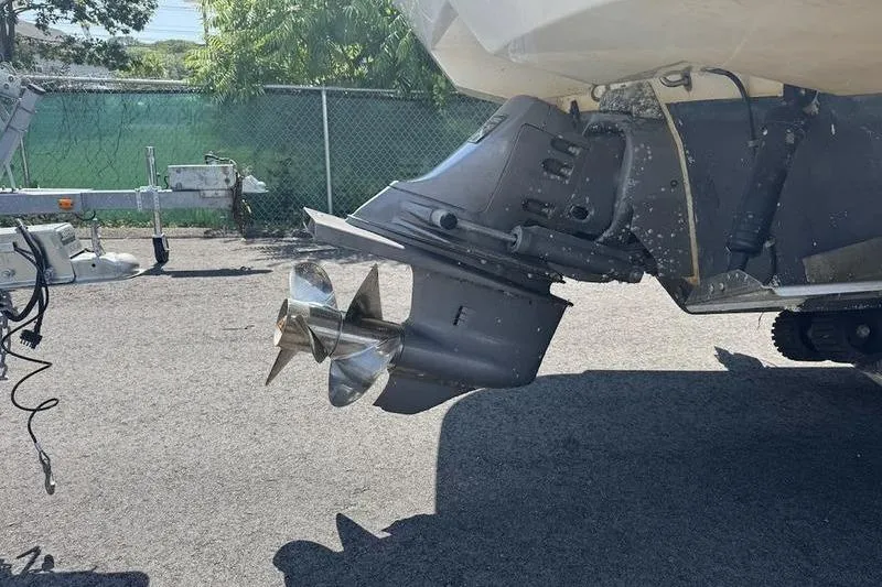 Slide: The Image of 2000 Weldcraft 26 Martinque boat propeller and outboard motor on a trailer. - 4