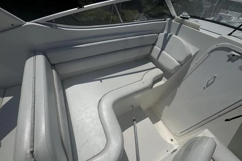 Slide: The Image of 2000 Weldcraft 26 Martinque boat interior with white seating and sleek design. - 6
