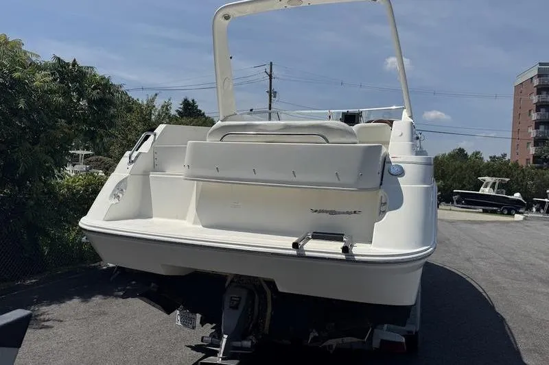 Slide: The Image of 2000 Weldcraft 26 Martinque boat, rear view, parked outdoors on a sunny day. - 8