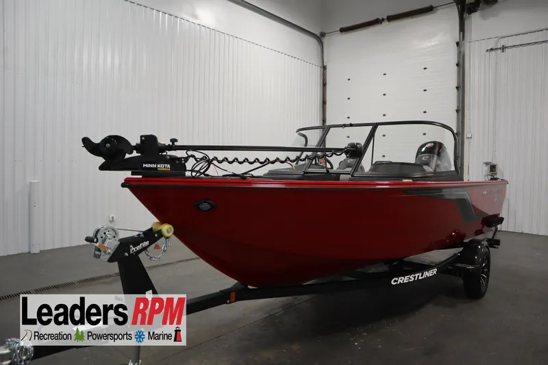 The Image of 2026 Crestliner 1750 Hawk Walkthrough boat in showroom, featuring Minn Kota trolling motor. - 0