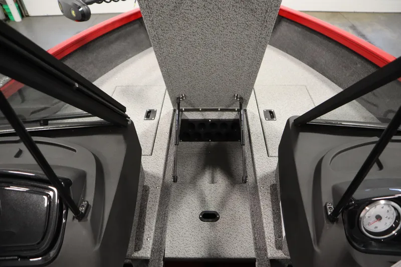 Slide: The Image of 2026 Crestliner 1750 Hawk Walkthrough boat interior with storage compartments and dashboard. - 18