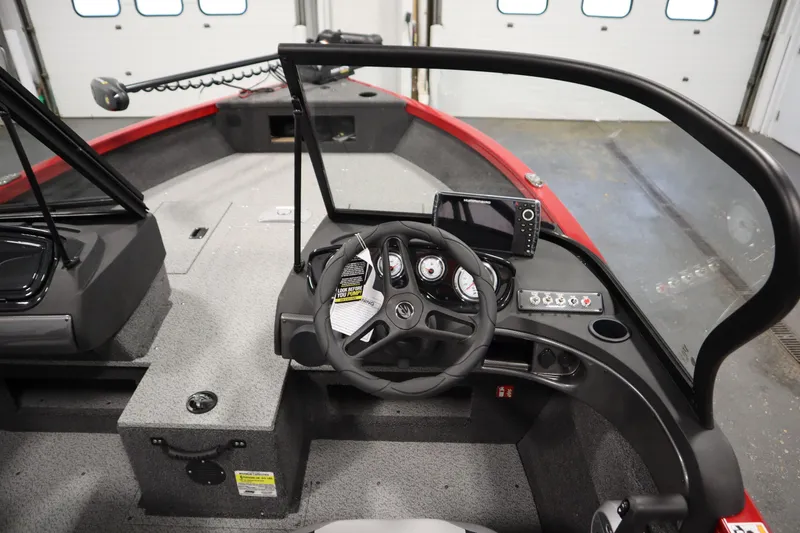 Slide: The Image of 2026 Crestliner 1750 Hawk Walkthrough boat interior with steering wheel and control panel. - 20