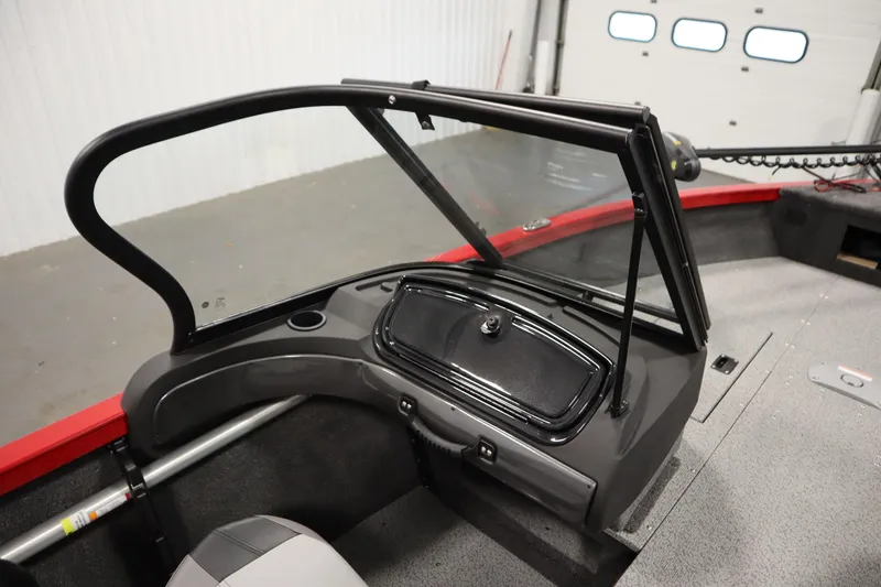 Slide: The Image of 2026 Crestliner 1750 Hawk Walkthrough boat interior with windshield and storage compartment. - 30