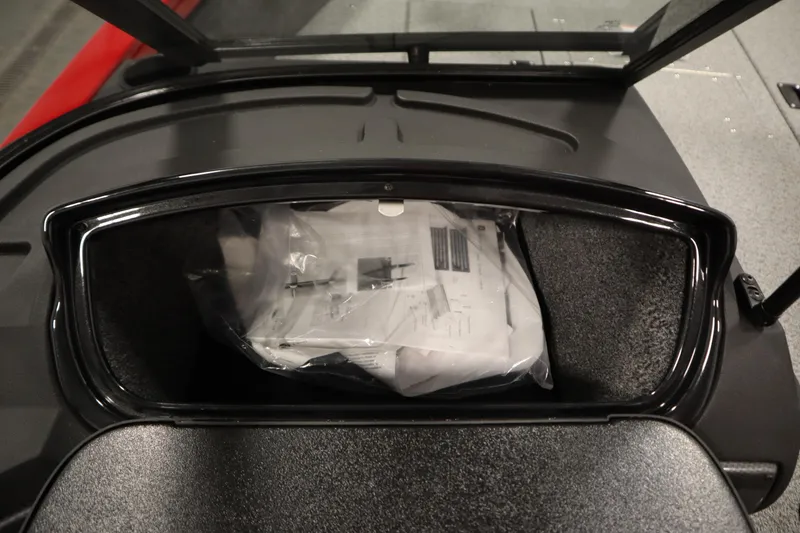 Slide: The Image of Storage compartment of 2026 Crestliner 1750 Hawk Walkthrough boat with documents inside. - 31