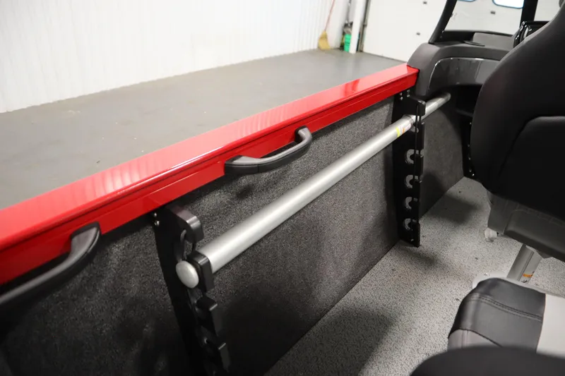 Slide: The Image of 2026 Crestliner 1750 Hawk Walkthrough interior with red trim and storage features. - 33