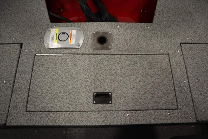 Slide: The Image of 2026 Crestliner 1750 Hawk Walkthrough boat deck with storage compartment and access panel. - 39