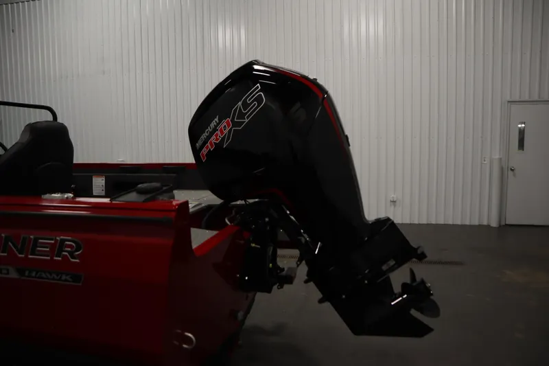 Slide: The Image of 2026 Crestliner 1750 Hawk Walkthrough with Mercury Pro XS engine in a garage. - 41