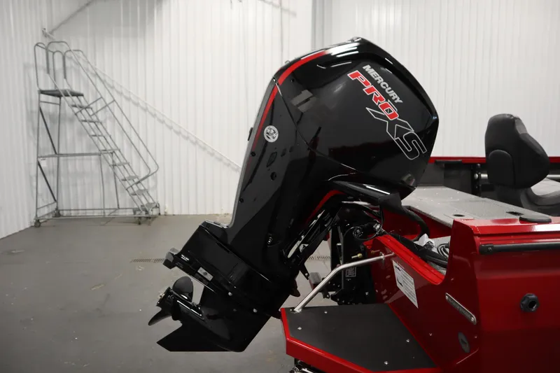 Slide: The Image of 2026 Crestliner 1750 Hawk Walkthrough with Mercury Pro XS outboard motor in a garage setting. - 42