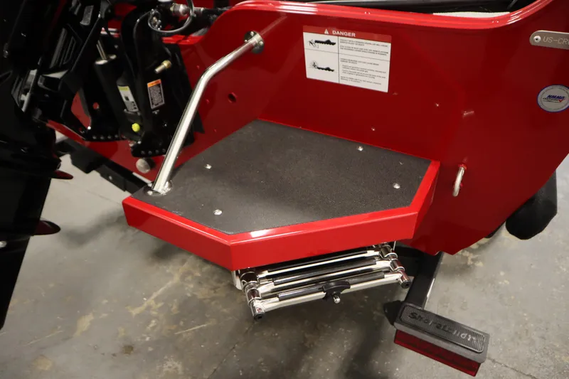 Slide: The Image of Rear view of 2026 Crestliner 1750 Hawk Walkthrough boat with red platform and ladder. - 44