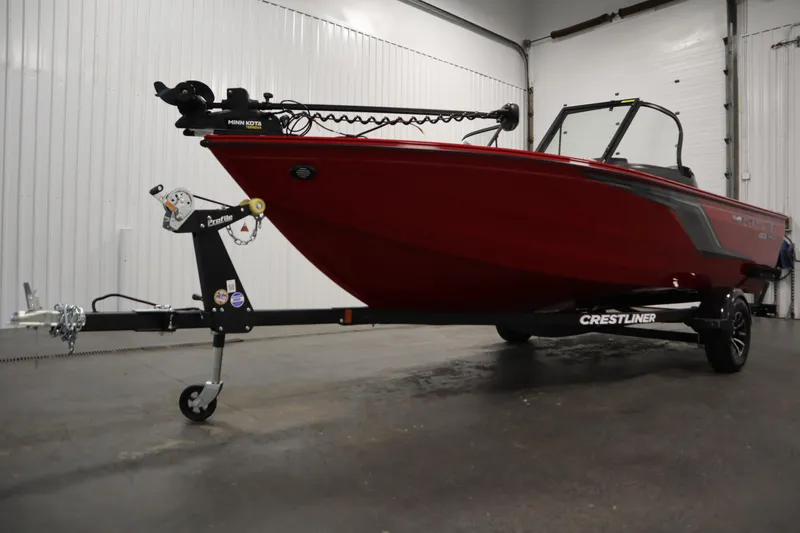 Slide: The Image of 2026 Crestliner 1750 Hawk Walkthrough boat on trailer in indoor setting. - 46