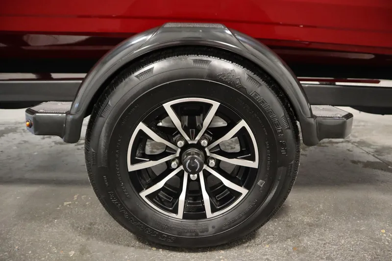 Slide: The Image of Trailer wheel of 2026 Crestliner 1750 Hawk Walkthrough, featuring black alloy rim. - 47