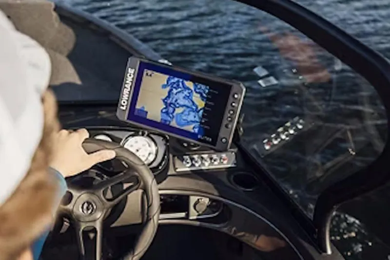 Slide: The Image of 2026 Crestliner 1750 Hawk dashboard with navigation system on water. - 49