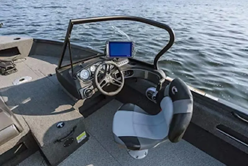 Slide: The Image of 2026 Crestliner 1750 Hawk boat interior with steering wheel and navigation system. - 53
