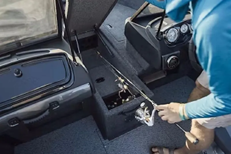 Slide: The Image of 2026 Crestliner 1750 Hawk interior with fishing rod storage and dashboard view. - 54