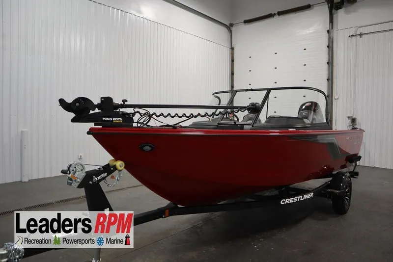 Slide: The Image of 2026 Crestliner 1750 Hawk boat in showroom, featuring Minn Kota trolling motor. - 55