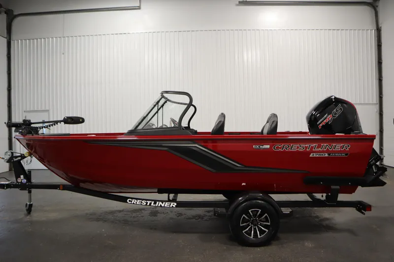 Slide: The Image of 2026 Crestliner 1750 Hawk Walkthrough boat in a showroom, featuring a sleek red design. - 7