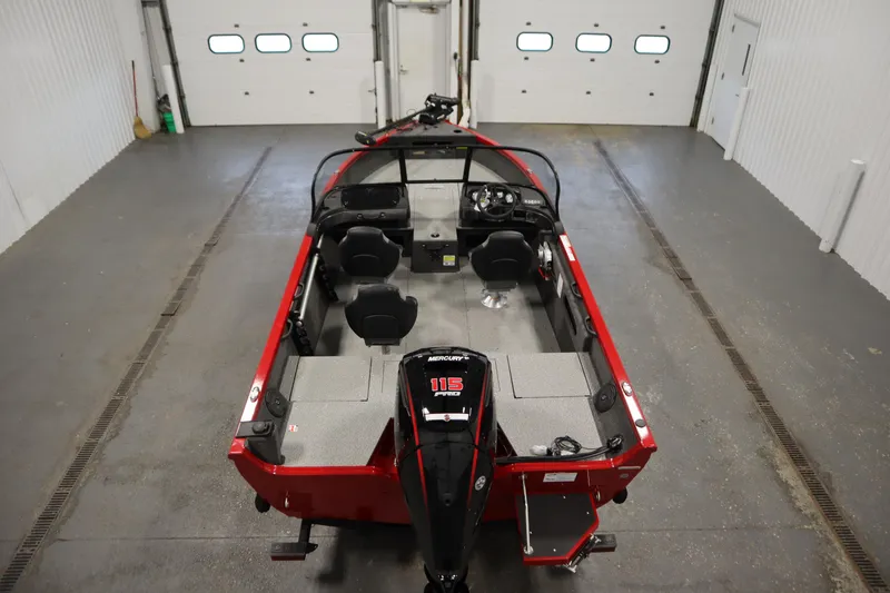 Slide: The Image of 2026 Crestliner 1750 Hawk Walkthrough boat in garage, red exterior, spacious interior layout. - 9