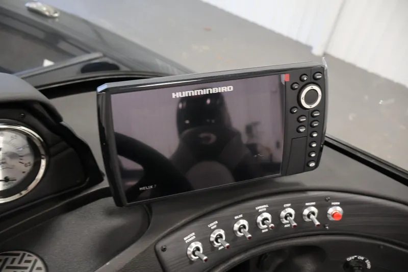 Slide: The Image of 2026 Crestliner 1750 Super Hawk boat interior with steering wheel and dashboard. - 19