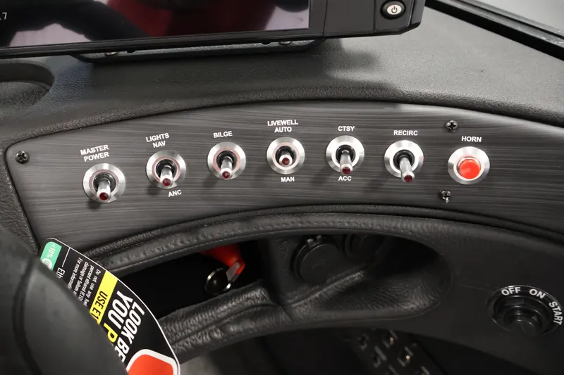 Slide: The Image of 2026 Crestliner 1750 Super Hawk boat dashboard with steering wheel and navigation system. - 20