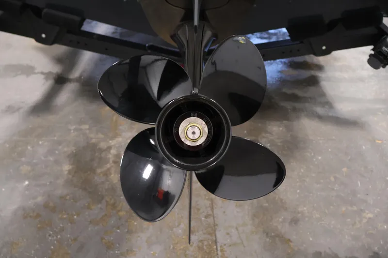 Slide: The Image of 2026 Crestliner 1750 Super Hawk with Mercury Pro XS outboard motor in a garage. - 29