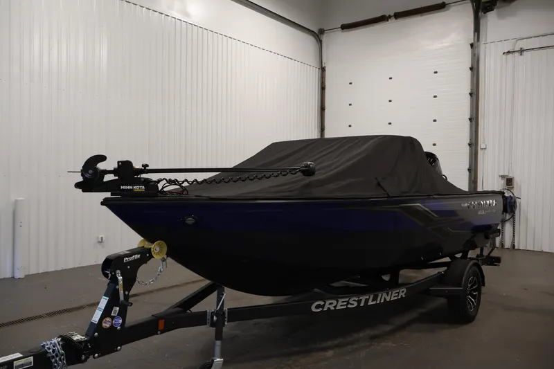 Slide: The Image of 2026 Crestliner 1750 Super Hawk with Mercury Pro XS outboard motor in a garage. - 33