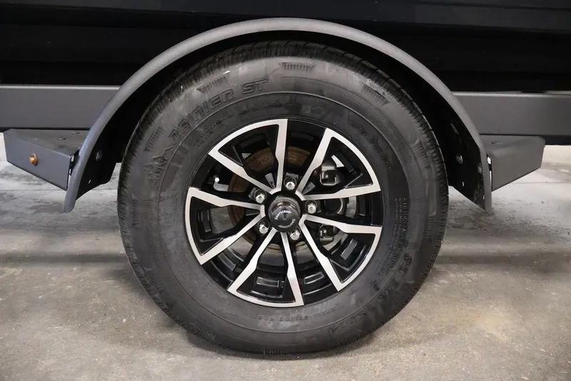 Slide: The Image of Trailer wheel of 2026 Crestliner 1750 Super Hawk, featuring black and silver alloy rim. - 41