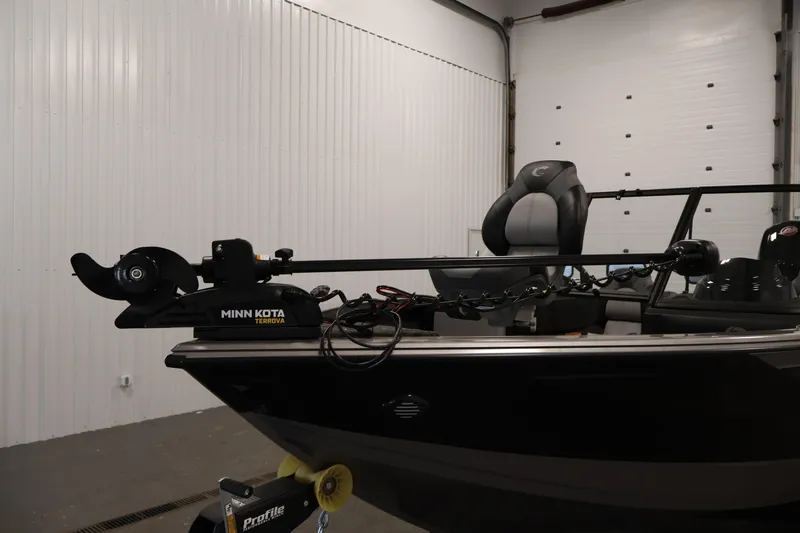 Slide: The Image of 2026 Crestliner 1850 Super Hawk boat with Minn Kota Terrova trolling motor in a garage. - 10