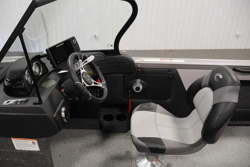 Slide: The Image of 2026 Crestliner 1850 Super Hawk boat interior with steering wheel and seat. - 15