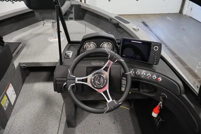 Slide: The Image of 2026 Crestliner 1850 Super Hawk dashboard with steering wheel and navigation system. - 16