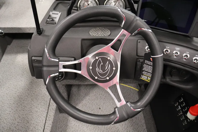 Slide: The Image of Steering wheel of 2026 Crestliner 1850 Super Hawk boat, featuring sleek design and modern controls. - 17