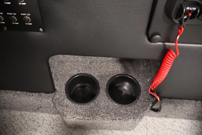 Slide: The Image of Dashboard of 2026 Crestliner 1850 Super Hawk with cup holders and red safety cord. - 22