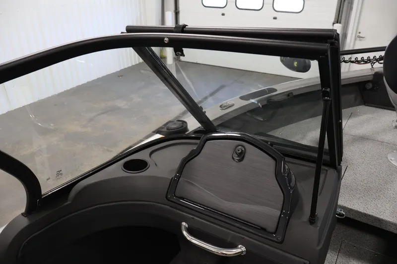 Slide: The Image of 2026 Crestliner 1850 Super Hawk boat interior with windshield and dashboard details. - 26