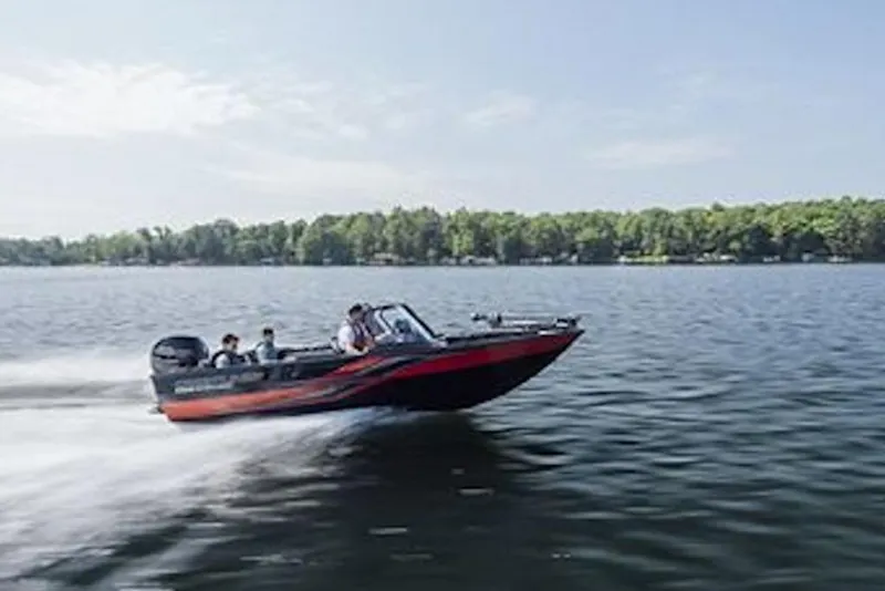 Slide: The Image of 2026 Crestliner 1850 Super Hawk boat speeding on a lake with passengers. - 3