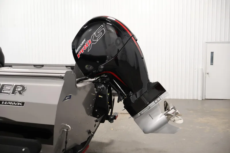 Slide: The Image of 2026 Crestliner 1850 Super Hawk with Mercury Pro XS outboard motor in a showroom. - 30