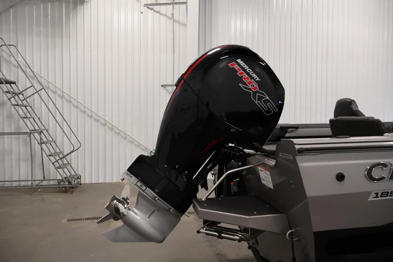 Slide: The Image of 2026 Crestliner 1850 Super Hawk with Mercury Pro XS outboard motor in a garage setting. - 31