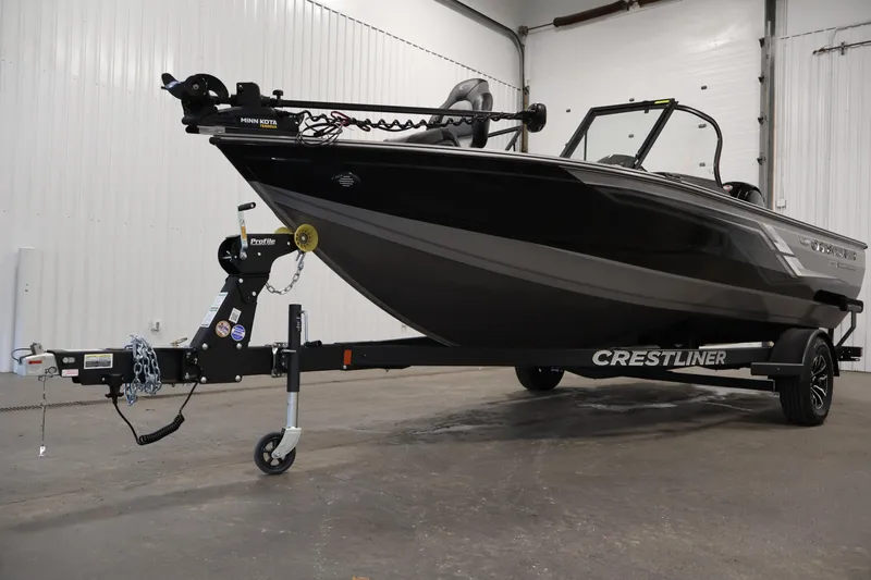 Slide: The Image of 2026 Crestliner 1850 Super Hawk boat on trailer in indoor setting. - 35