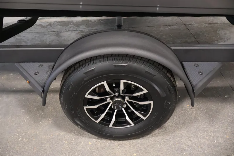 Slide: The Image of 2026 Crestliner 1850 Super Hawk trailer wheel with black alloy rim and tire. - 36