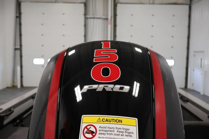 Slide: The Image of 2026 Crestliner 1850 Super Hawk outboard motor with "150 Pro" label in a garage. - 38