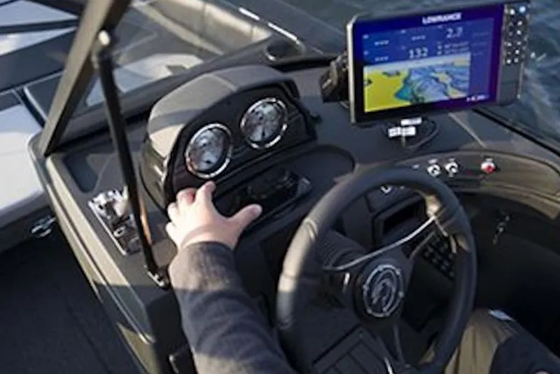 Slide: The Image of 2026 Crestliner 1850 Super Hawk dashboard with navigation system and steering wheel. - 4