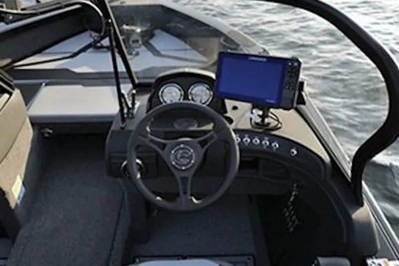 Slide: The Image of 2026 Crestliner 1850 Super Hawk boat dashboard with steering wheel and navigation system. - 5