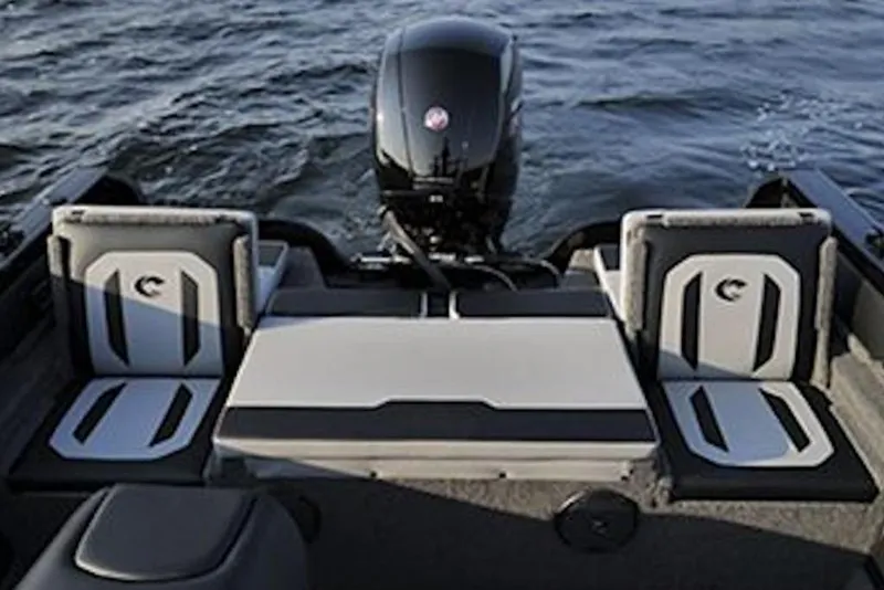 Slide: The Image of 2026 Crestliner 1850 Super Hawk boat interior with seating and motor on water. - 6