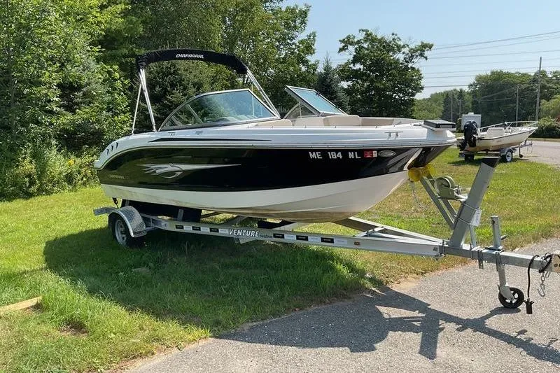 Slide: The Image of 2013 Chaparral H2O Fish & Ski boat on trailer, parked on grass. - 10
