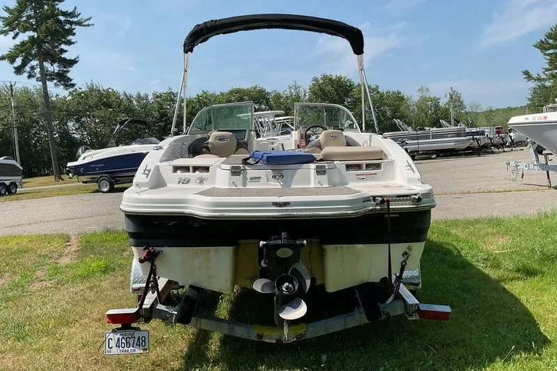 Slide: The Image of 2013 Chaparral H2O Fish & Ski boat parked on grass, rear view. - 6
