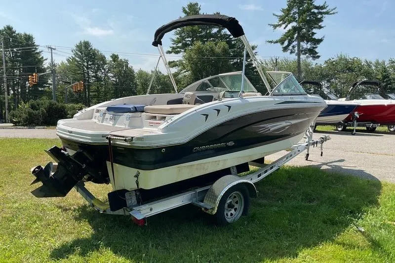 Slide: The Image of 2013 Chaparral H2O Fish & Ski boat on trailer, parked on grass. - 7