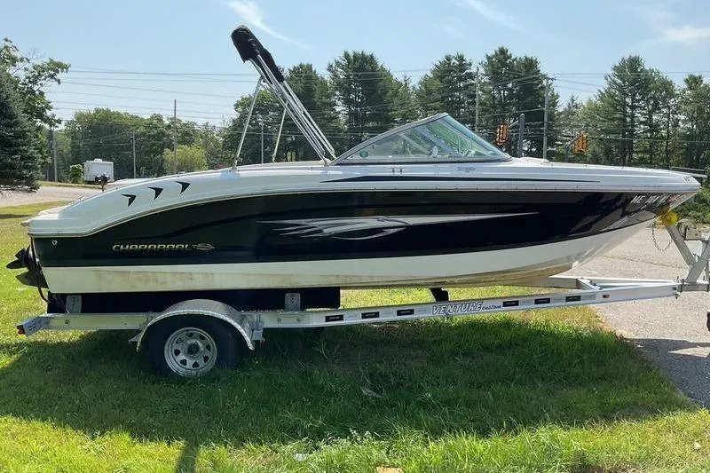 Slide: The Image of 2013 Chaparral H2O Fish & Ski boat on trailer, parked on grass. - 8