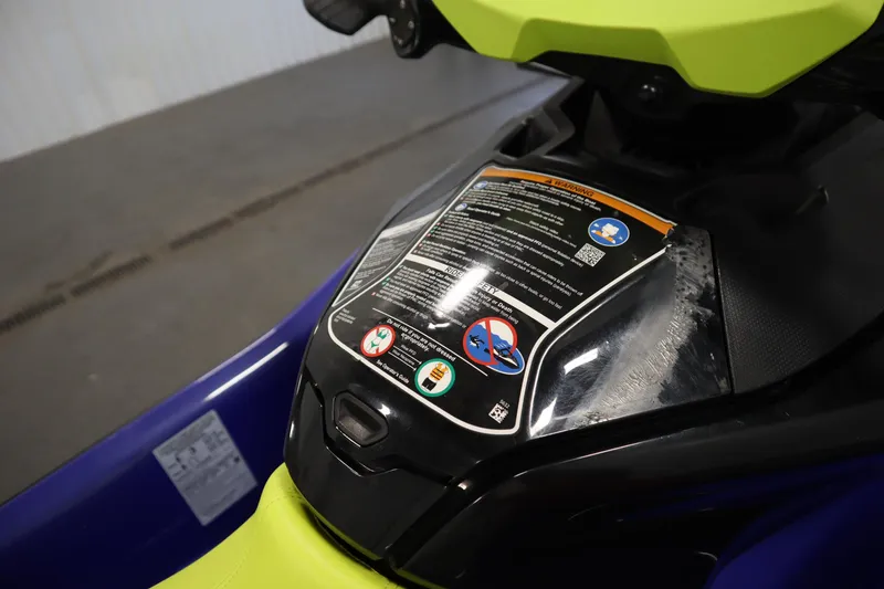 Slide: The Image of 2020 Sea-Doo Wake Pro 230 dashboard with safety instructions and vibrant seat. - 16