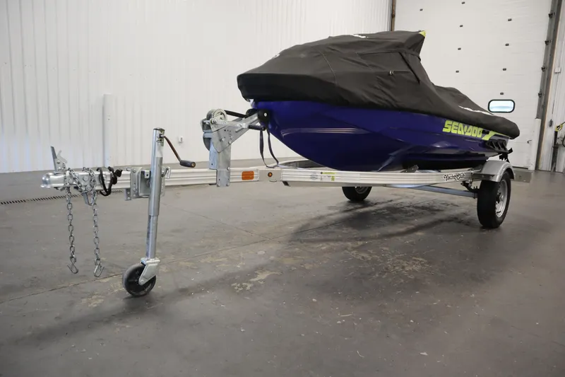 Slide: The Image of 2020 Sea-Doo Wake Pro 230 on trailer, covered, in indoor storage. - 27