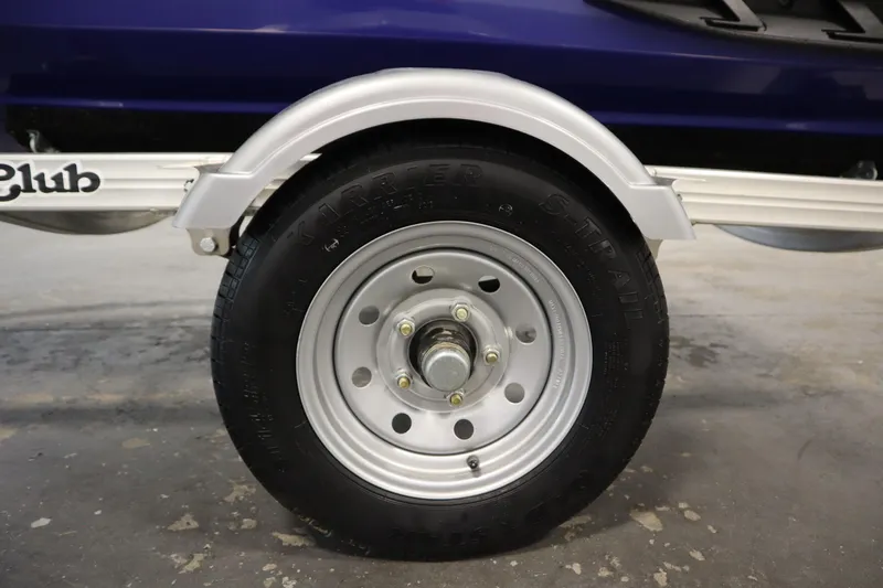 Slide: The Image of Trailer wheel of a 2020 Sea-Doo Wake Pro 230, featuring a silver rim and black tire. - 28