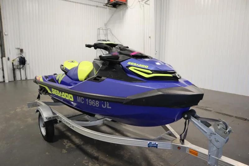 Slide: The Image of 2020 Sea-Doo Wake Pro 230 jet ski on trailer in indoor setting. - 3