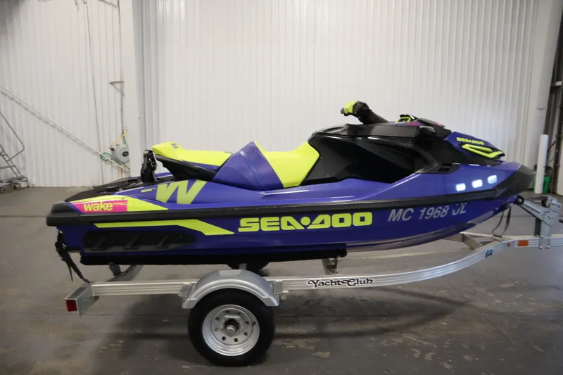 Slide: The Image of 2020 Sea-Doo Wake Pro 230 jet ski on trailer in indoor setting. - 4